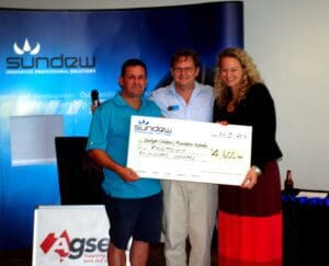 David Priddy (center) C.E.O. Sundew Solutions presenting the cheque for $4,600 to Starlight Charity